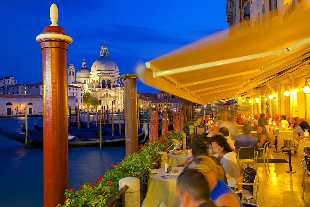 Santa Maria della Salute and restaurant at dusk, Dorsoduro, Venice, UNESCO World Heritage Site, Veneto, Italy, Europe