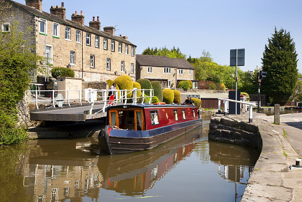 Narrowboat passing a Swing Bridge at Skipton, North Yorkshire, Yorkshire, England, United Kingdom, Europe