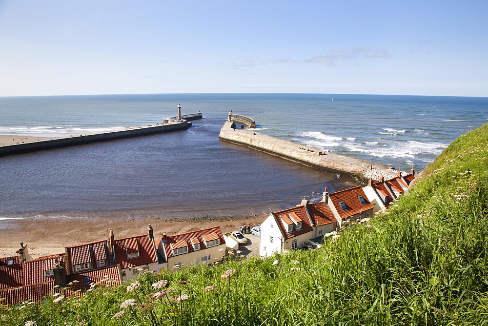 Whitby harbour walls and lighthouses from the clifftop, Whitby, North Yorkshire, Yorkshire, England, United Kingdom, Europe