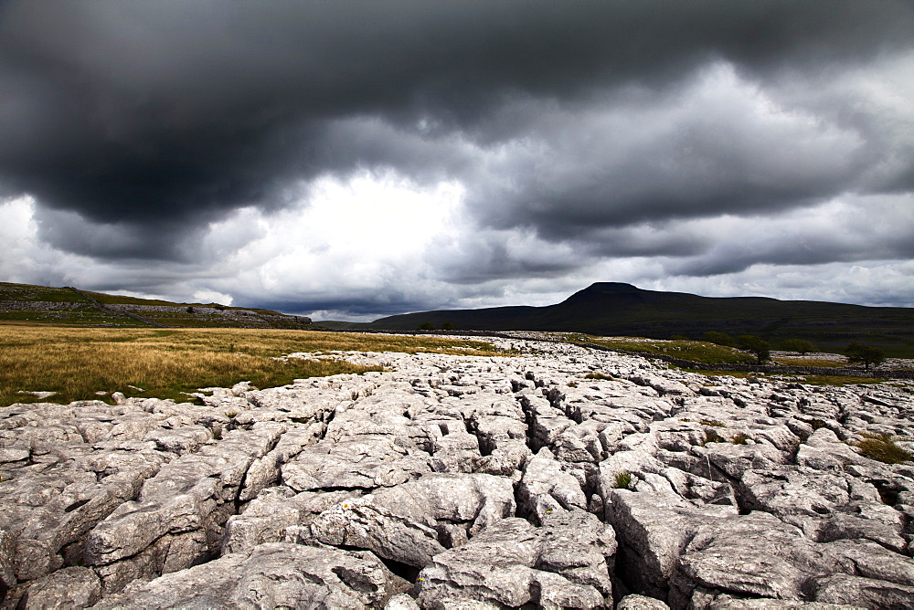 Dark clouds over Ingleborough from Twisleton Scar, Yorkshire Dales, North Yorkshire, Yorkshire, England, United Kingdom, Europe