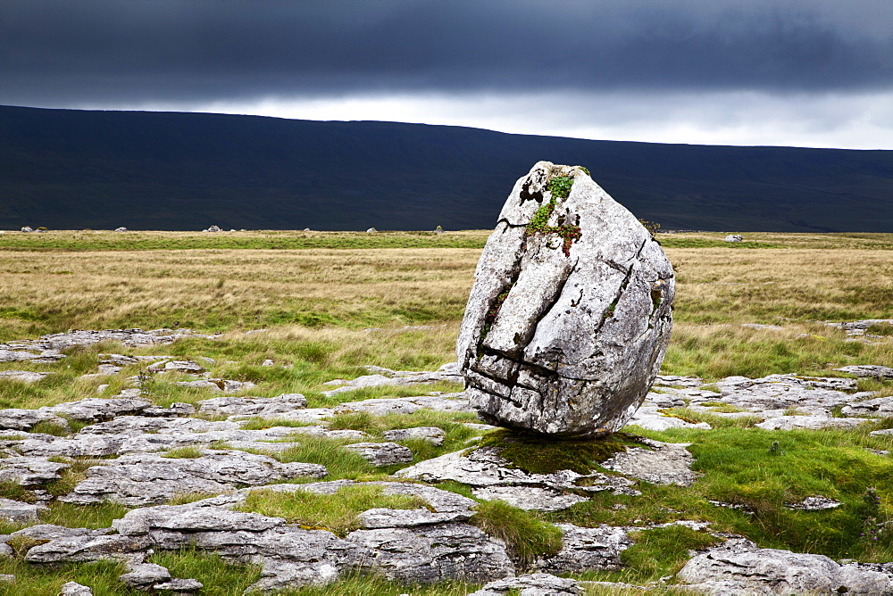 Dark clouds and Standing Stone on Twisleton Scar, Yorkshire Dales, North Yorkshire, Yortkshire, England, United Kingdom, Europe