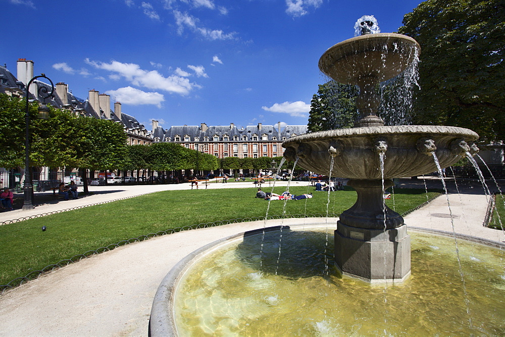 Fountain in Place des Vosges in The Marais, Paris, France, Europe