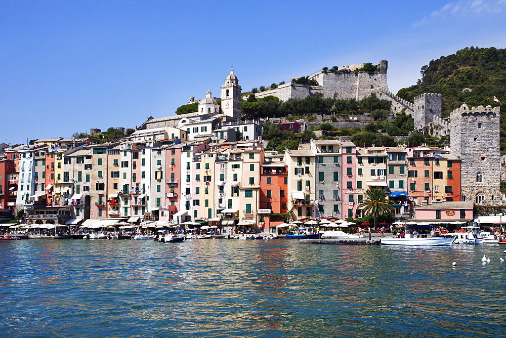 Brightly painted houses and medieval Town Walls by the Marina at Porto Venere, Cinque Terre, UNESCO World Heritage Site, Liguria, Italy, Mediterranean, Europe