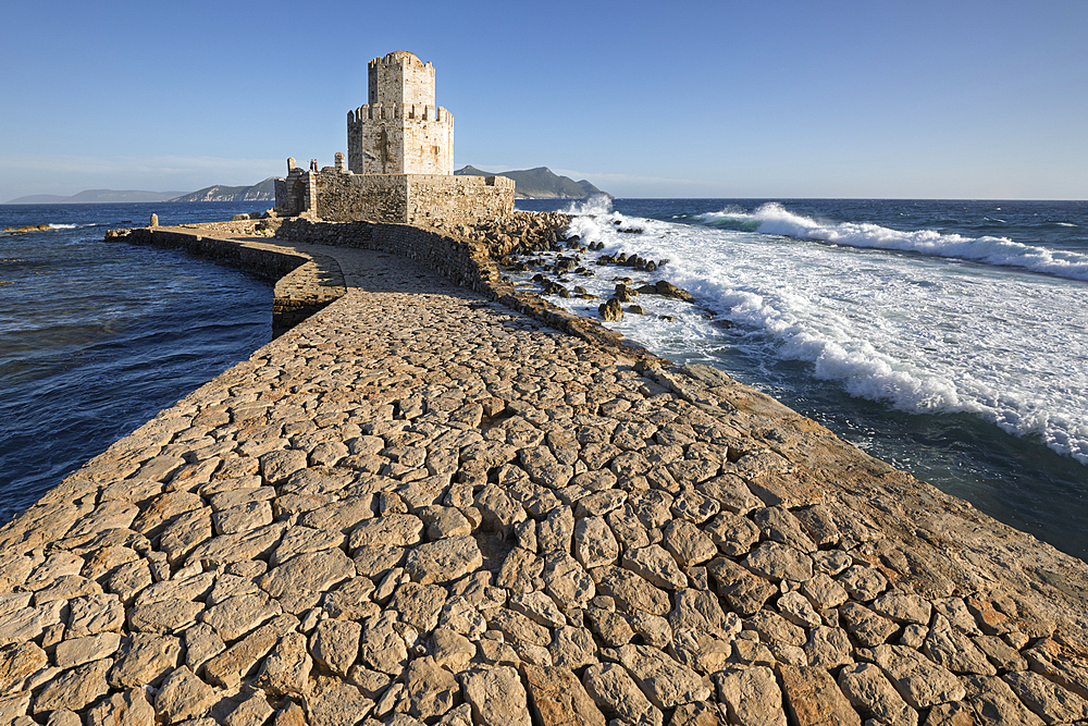 Bourtzi octagonal tower of Methoni Castle and the stone bridge in stormy sea, Methoni, Messenia, Peloponnese, Greece, Europe