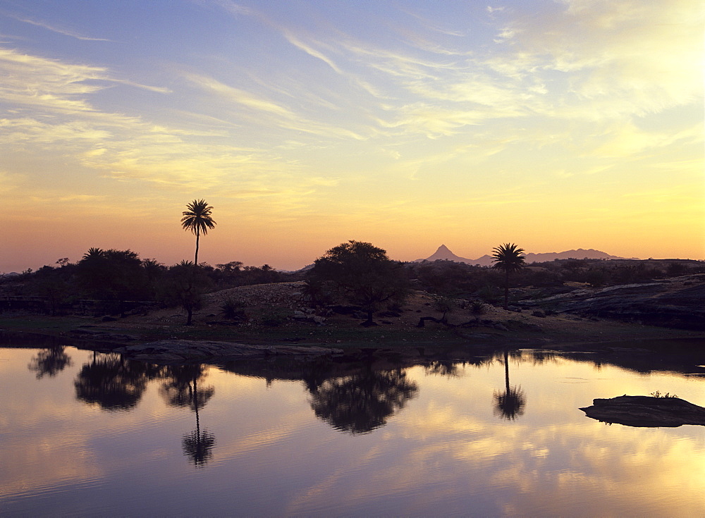 Sunrise over the lake at Fort Seengh Sagar in Rajasthan, India, Asia