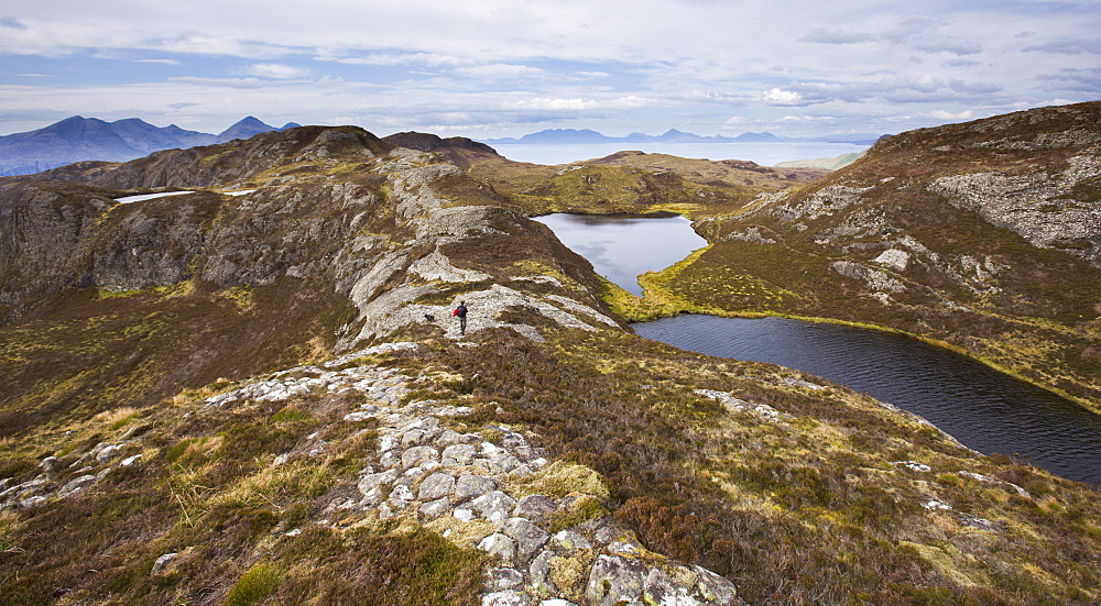 Walking along the pitchstone ridges on Eigg, Inner Hebrides, Scotland, United Kingdom, Europe