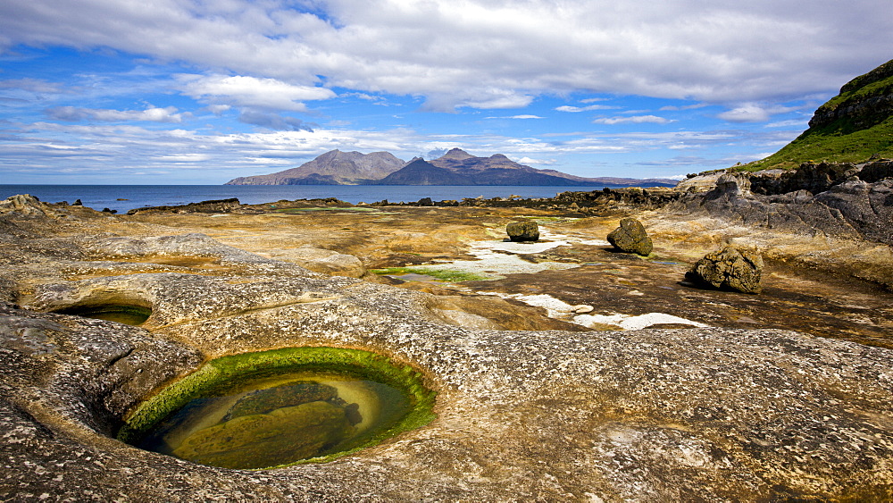 Looking towards Rum from the rock formations beyond Laig Bay, Isle of Eigg, Inner Hebrides, Scotland, United Kingdom, Europe