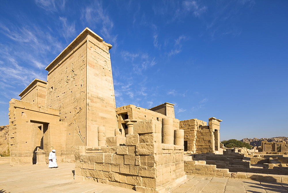 Man in jellabiya by the first pylon and the Gate of Ptolemy at the Temple of Isis, Philae, UNESCO World Heritage Site, Nubia, Egypt, North Africa, Africa