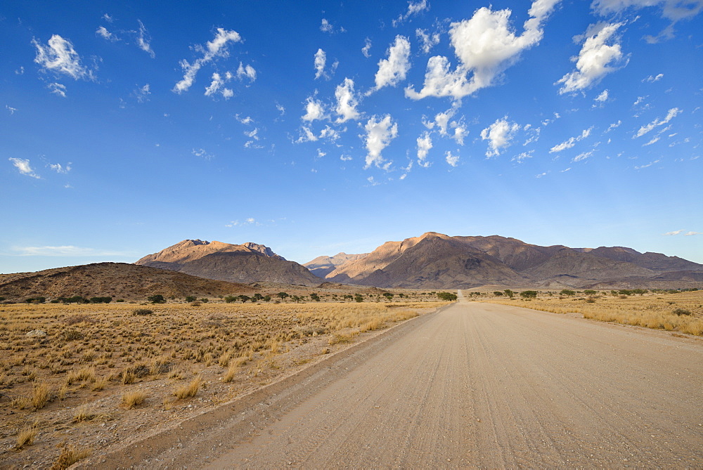 Gravel road leading to the Brandberg mountain trails, Damaraland, Namibia, Africa