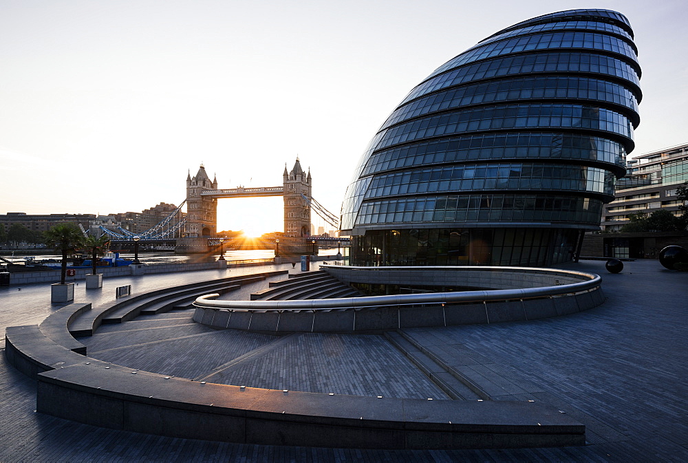 Sunrise behind Tower Bridge and The Mayor's Building (City Hall), London, England, United Kingdom, Europe