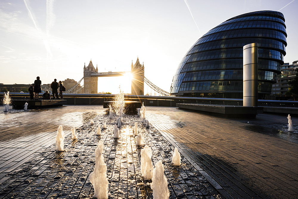 Sunrise behind Tower Bridge and The Mayor's Building (City Hall), London, England, United Kingdom, Europe