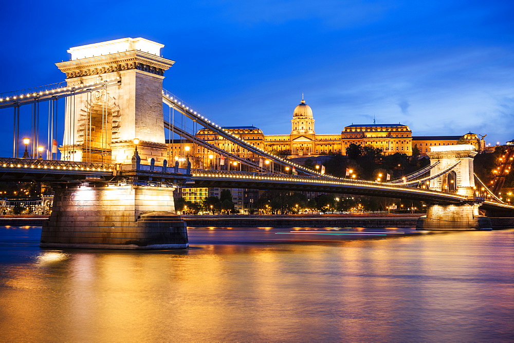 View across Danube River of Chain Bridge and Buda Castle at night, UNESCO World Heritage Site, Budapest, Hungary, Europe