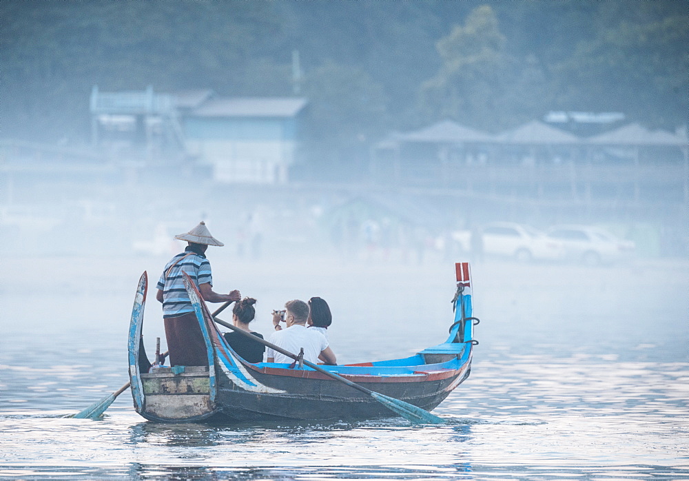 Tourist boats enjoying view of U-Bein Bridge at sunset, Mandalay, Mandalay Region, Myanmar (Burma), Asia