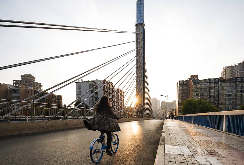 Sunrise behind modern bridge, Kunming, Yunnan Province, China, Asia