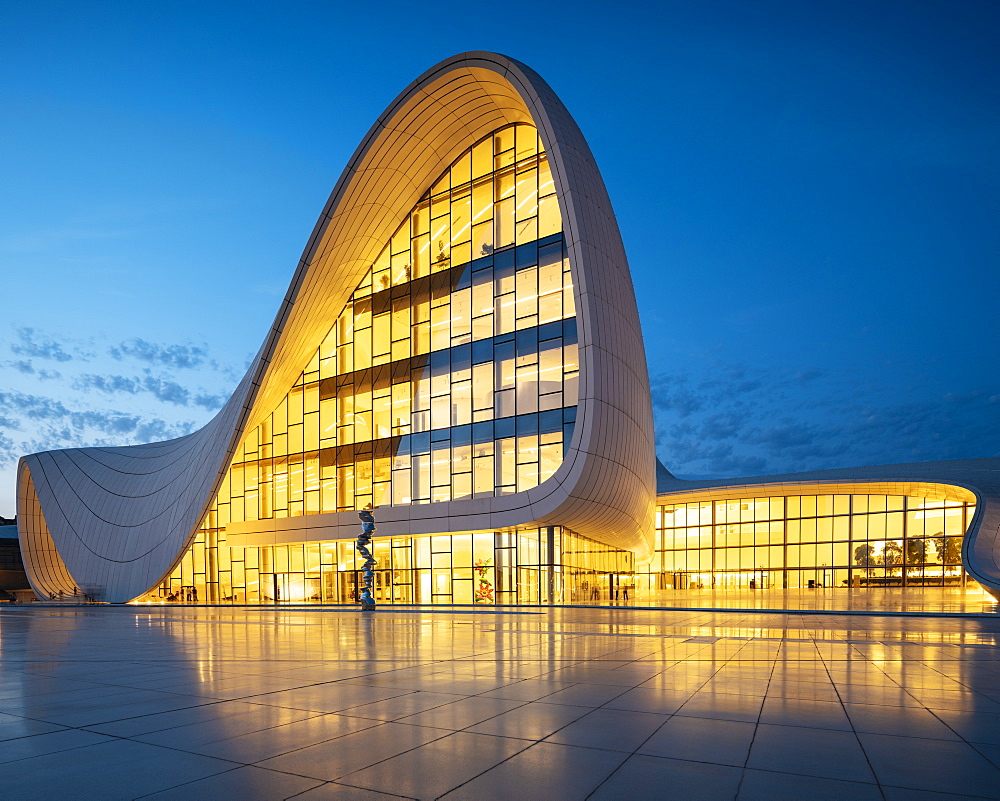 Exterior of Heydar Aliyev Building at night, designed by Zaha Hadid, Baku, Azerbaijan, Central Asia, Asia