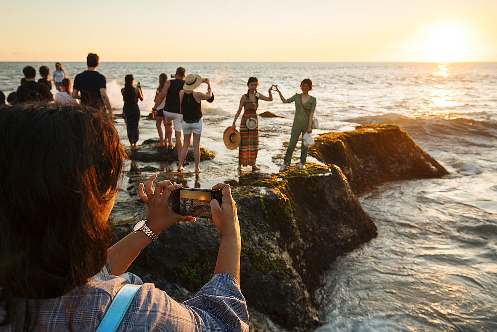 Tourists enjoying sunset at Tanah Lot Temple, Bali, Indonesia, Southeast Asia, Asia