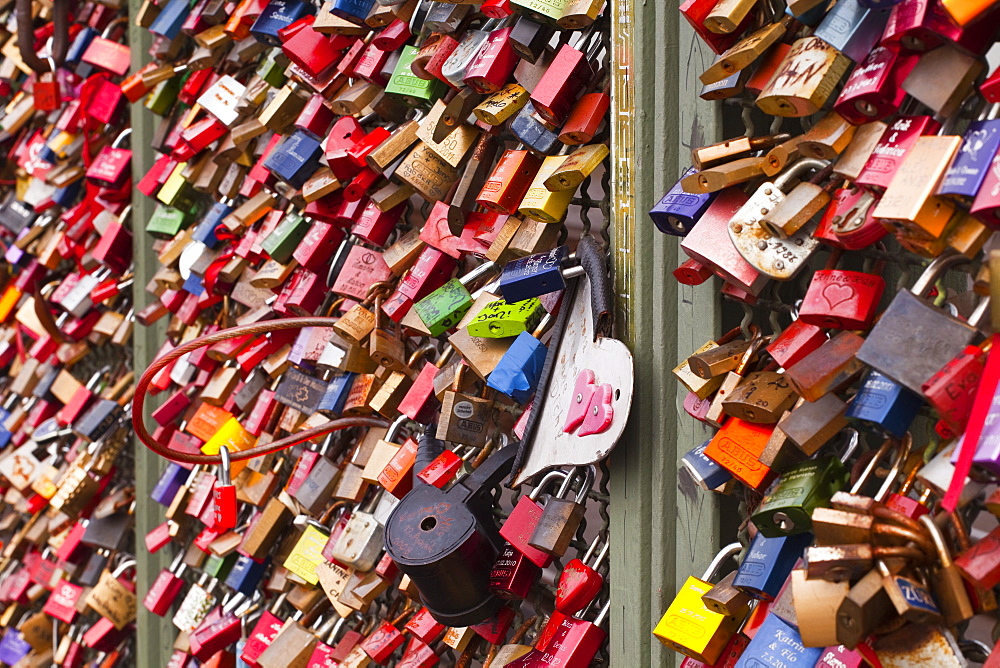 Love locks on the railway bridge in Cologne, North Rhine-Westphalia, Germany, Europe