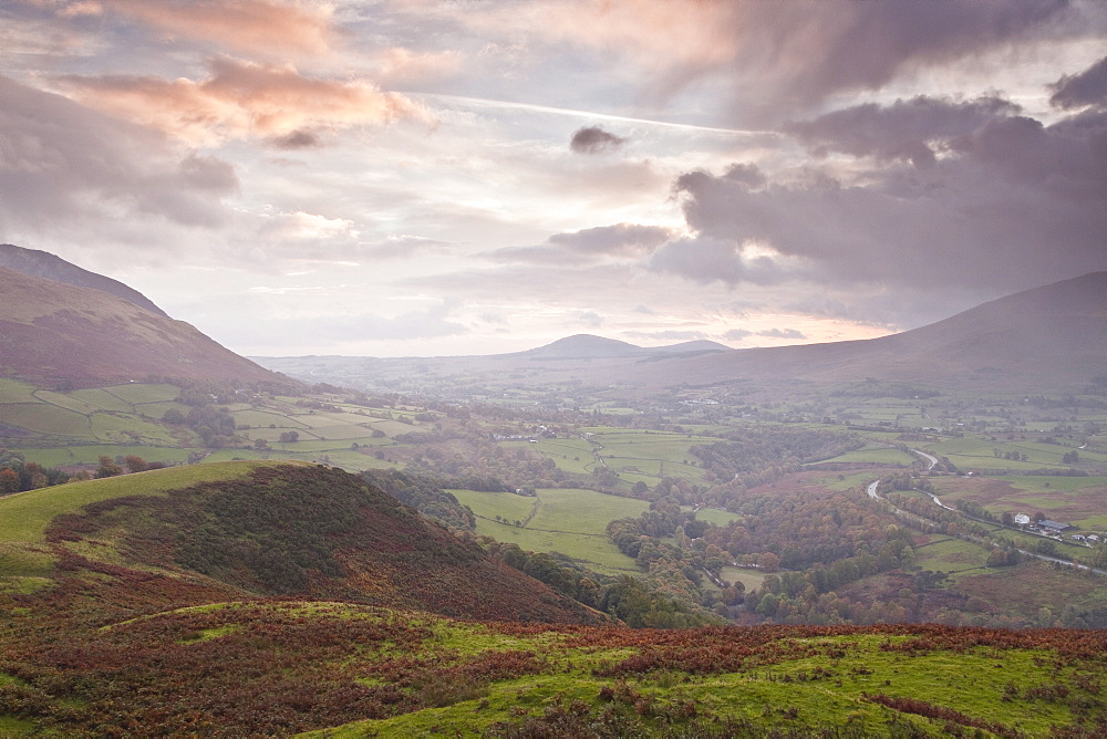 Rain clouds battle with the sunrise over the Lake District near to Keswick, Cumbria, England, United Kingdom, Europe