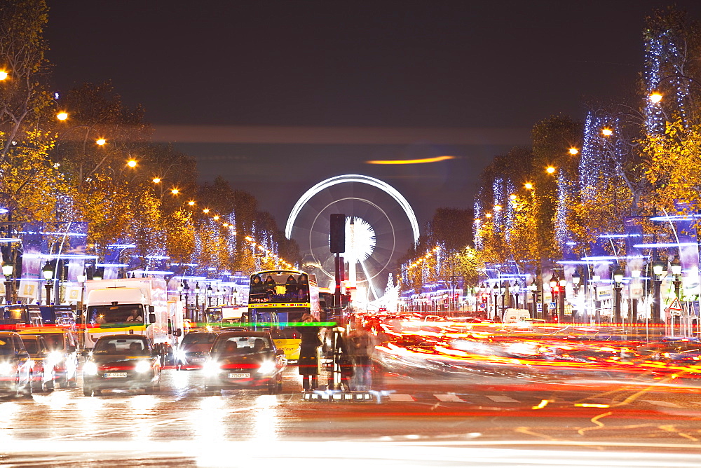 The Champs Elysees lit up by Christmas lights, Paris, France, Europe