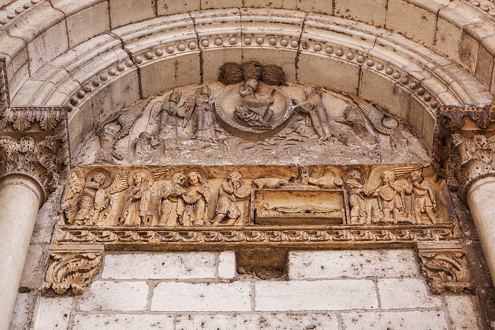 Ancient stonework on an old church door at La Charite-sur-Loire, France, Europe