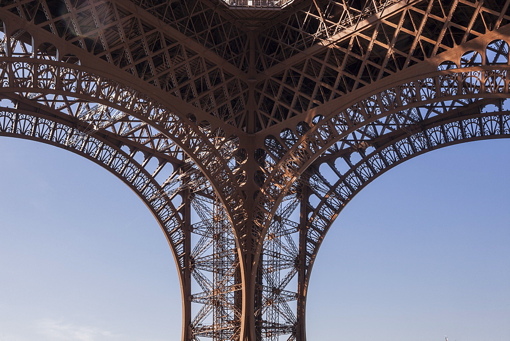 Looking up to the impressive Eiffel Tower in Paris, France, Europe