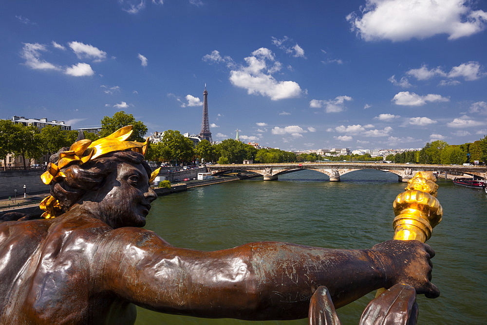 Looking down the waters of the River Seine in Paris towards the Eiffel Tower from Pont Alexandre III, Paris, France, Europe