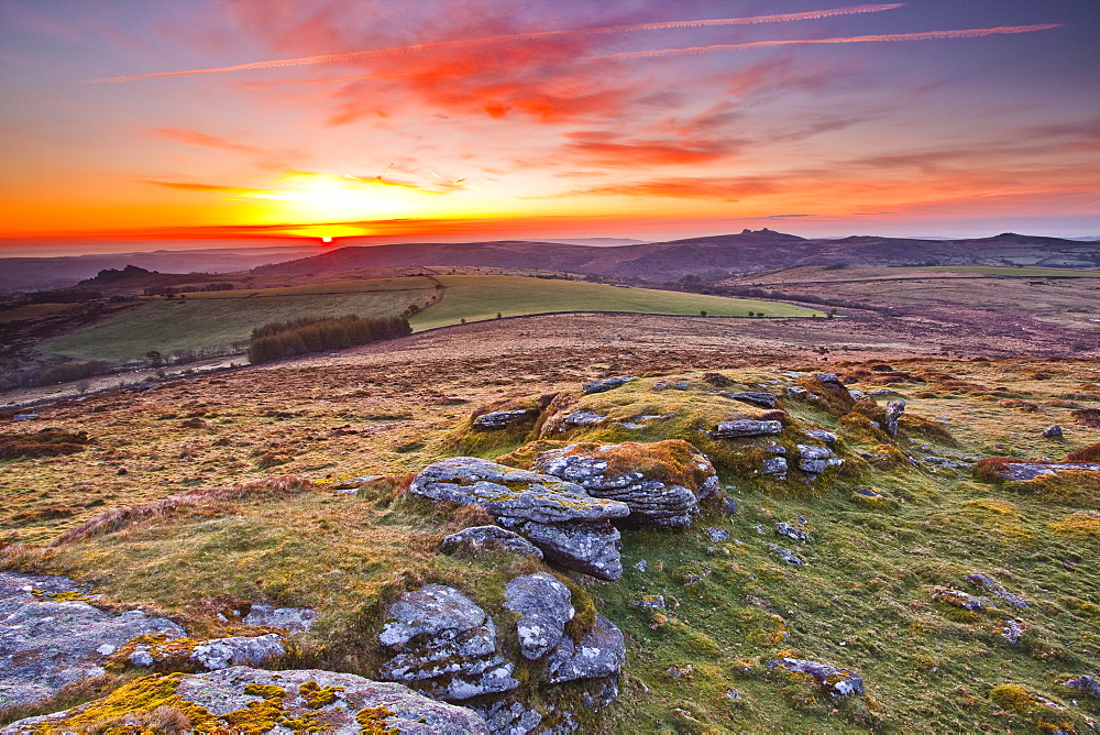 A colourful dawn on Chinkwell Tor in Dartmoor National Park, Devon, England, United Kingdom, Europe