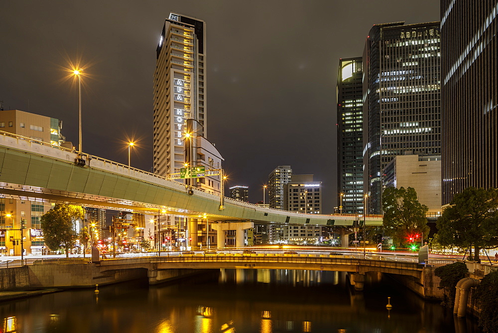 High rise office buildings in the Dotonbori area of Osaka at night, Osaka, Japan, Asia