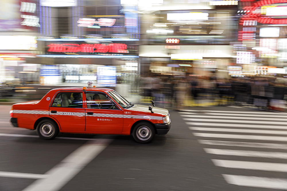 Taxi speeding through the streets of Shinjuku, Tokyo, Asia