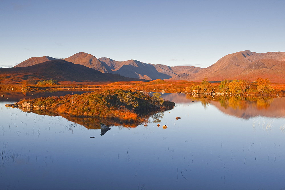 Lochan na h-Achlaise reflecting the surrounding mountains on Rannoch Moor, a Site of Special Scientific Interest, Scotland, United Kingdom, Europe