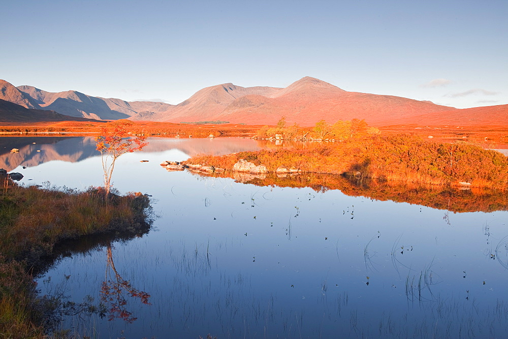 Lochan na h-Achlaise reflecting the surrounding mountains on Rannoch Moor, a Site of Special Scientific Interest, Scotland, United Kingdom, Europe