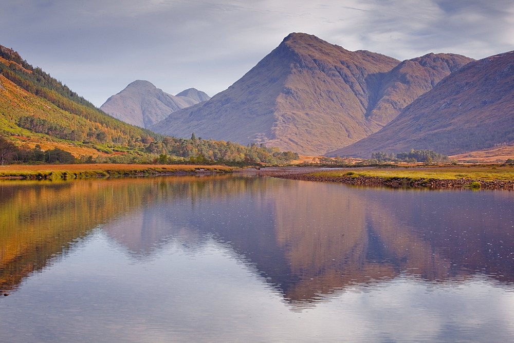 The waters of Loch Etive reflecting the surrounding mountains, Argyll and Bute, Scotland, United Kingdom, Europe