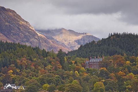 Houses dotted on the mountain side in Glencoe, Highlands, Scotland, United Kingdom, Europe