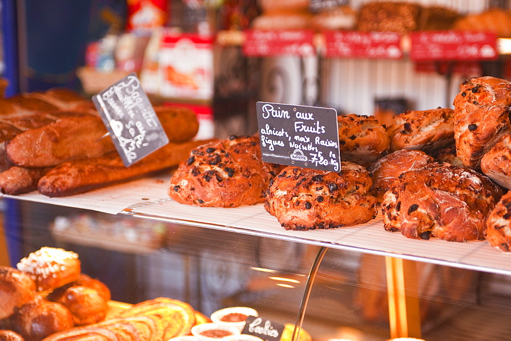 Pain aux fruits and other delights on sale at a bakery in Lyons-la-Foret, Eure, Normandy, France, Europe