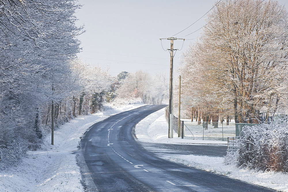 A snow covered road near to Villefranche-sur-Cher, Loir-et-Cher, Centre, France, Europe 