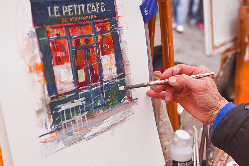 A street artist at work in the famous Place du Tertre in Montmartre, Paris, France, Europe