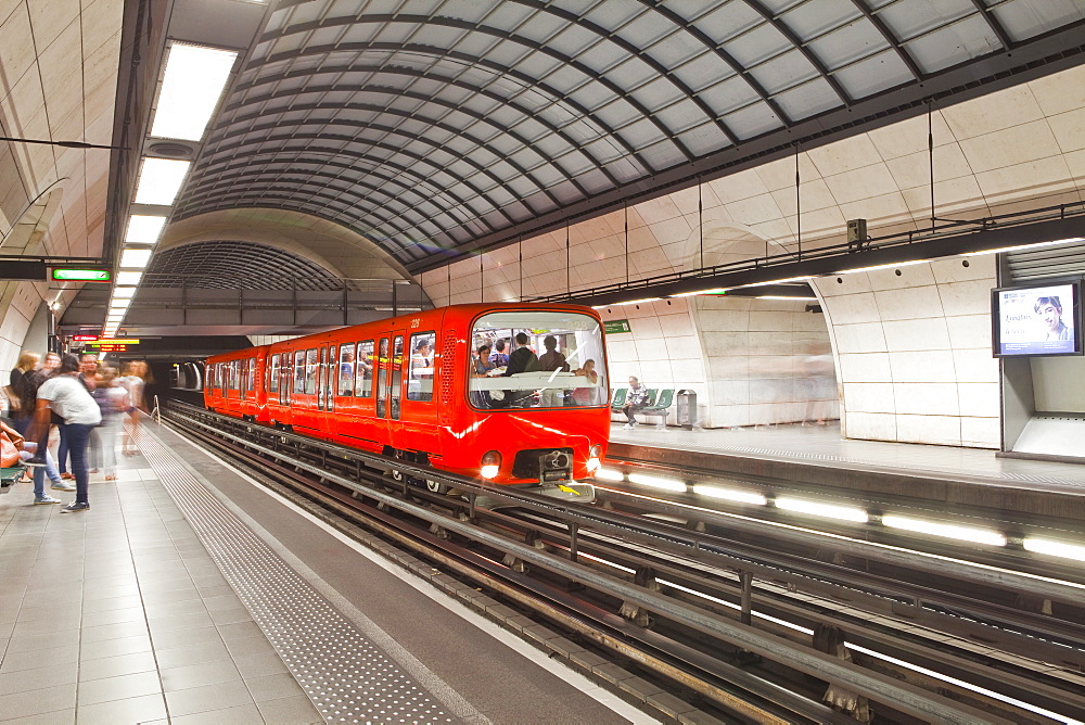 A train pulls into a station on the Lyon metro system, Lyon, Rhone, Rhone-Alpes, France, Europe