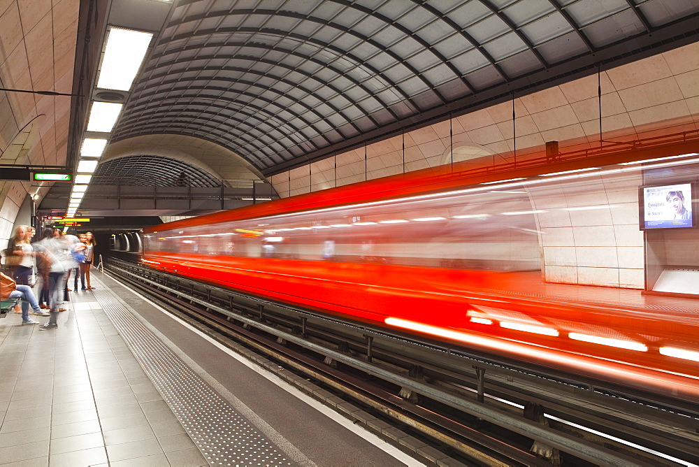 A train pulls out of a station on the Lyon metro system, Lyon, Rhone, Rhone-Alpes, France, Europe