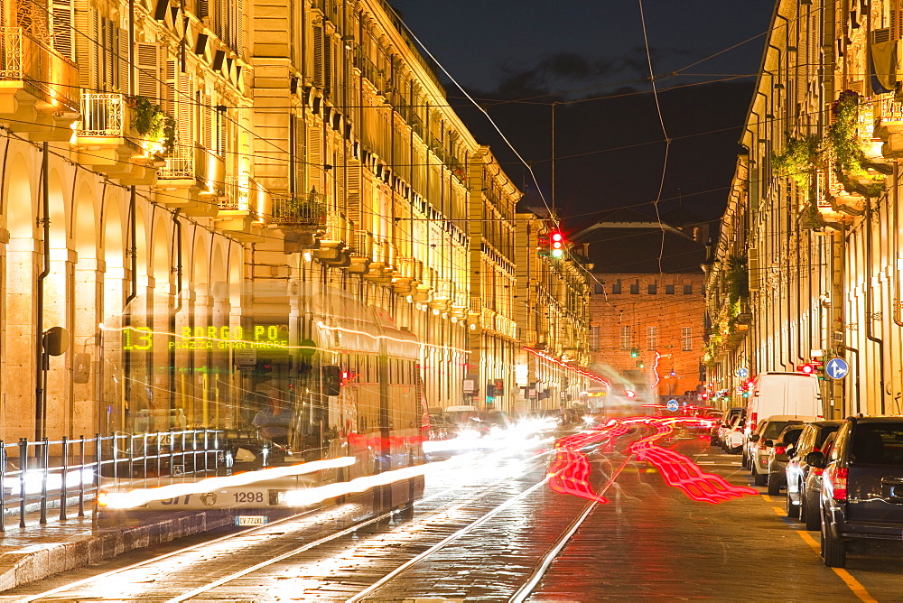 Via Po avenue lit up at night by passing traffic, Turin, Piedmont, Italy, Europe