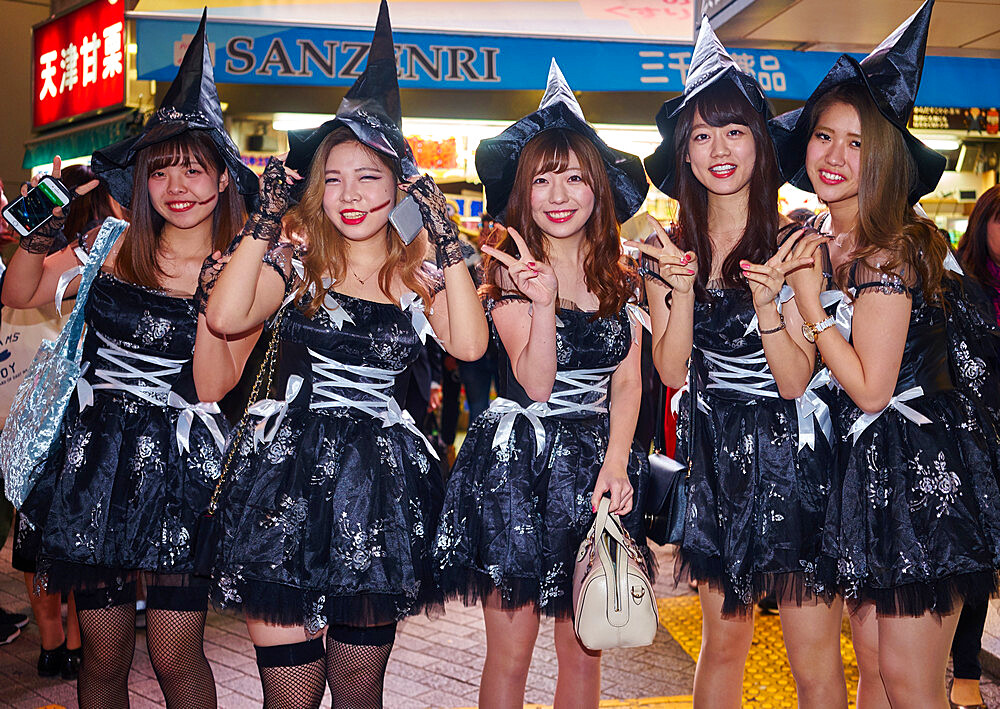 A group of young Japanese girls dressed as witches at the Halloween celebrations in Shibuya, Tokyo, Japan, Asia