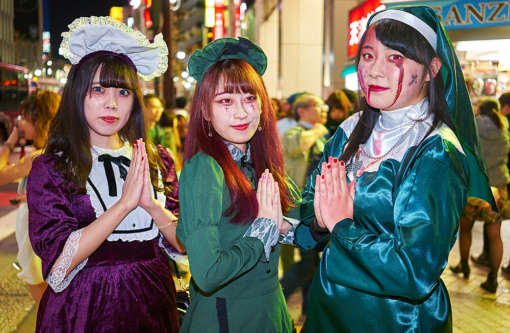 Young Japanese girls dressed as nuns at the Halloween celebrations in Shibuya, Tokyo, Japan, Asia