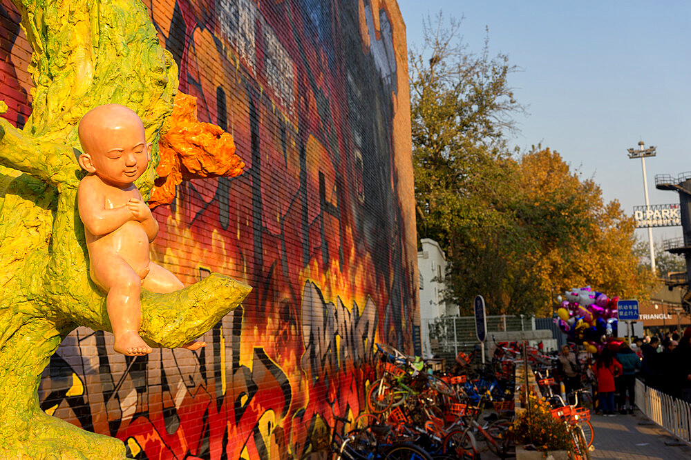 Child sculpture and King Kong graffiti at the 798 Art Zone (Dashanzi Art District) in Beijing, China, Asia