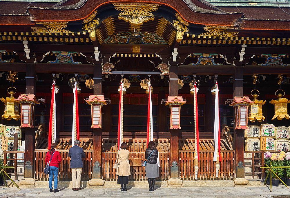 People praying at Kitano Tenmangu Shrine, Kyoto, Japan, Asia