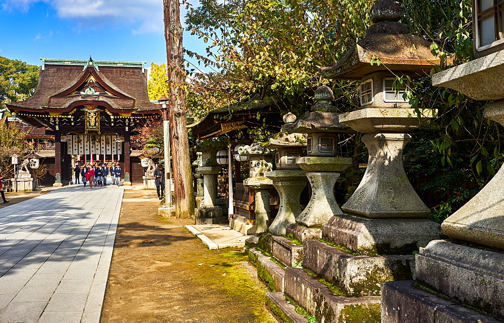 Stone lanterns at the entrance to the Kitano Tenmangu Shrine, Kyoto, Japan, Asia