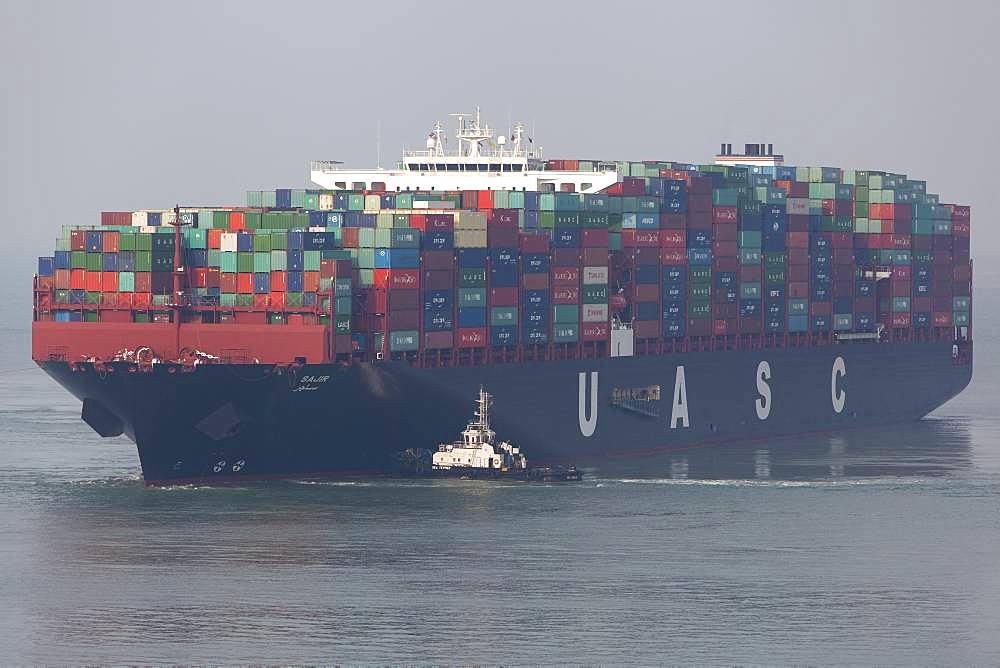 Container ships and tugs, Port Kelang, Malaysia.