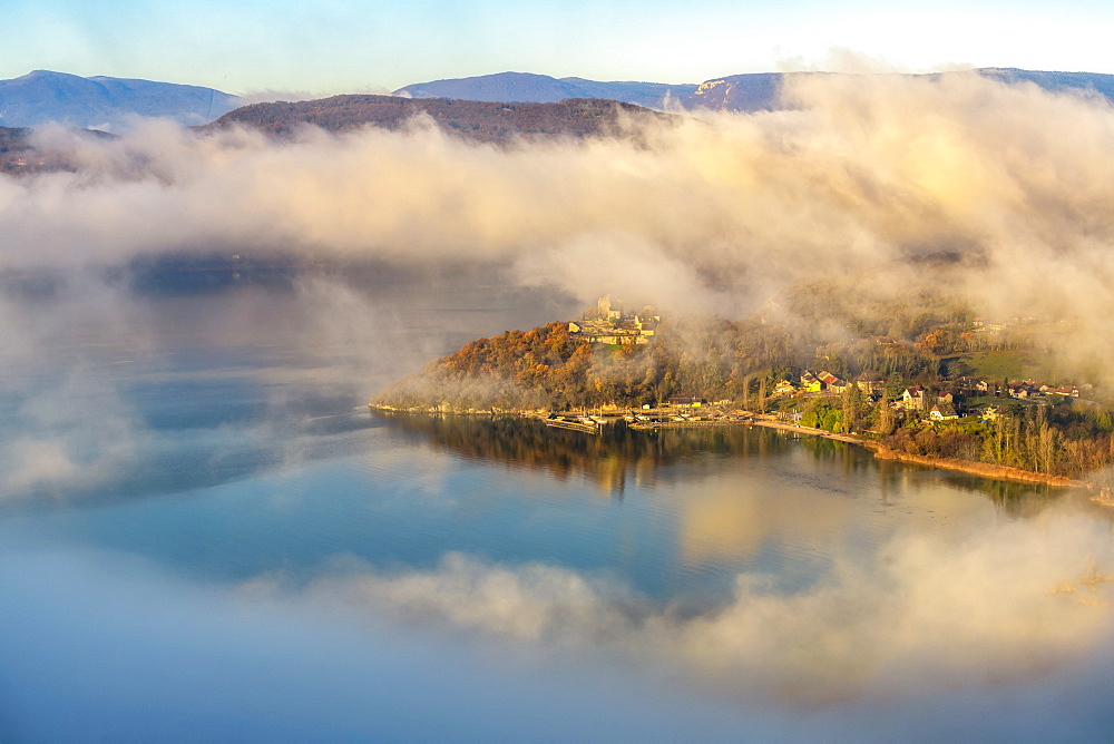 Castle overlooking Chatillon Bay and autumn mists north of Lake Bourget, Savoie, Alps, France