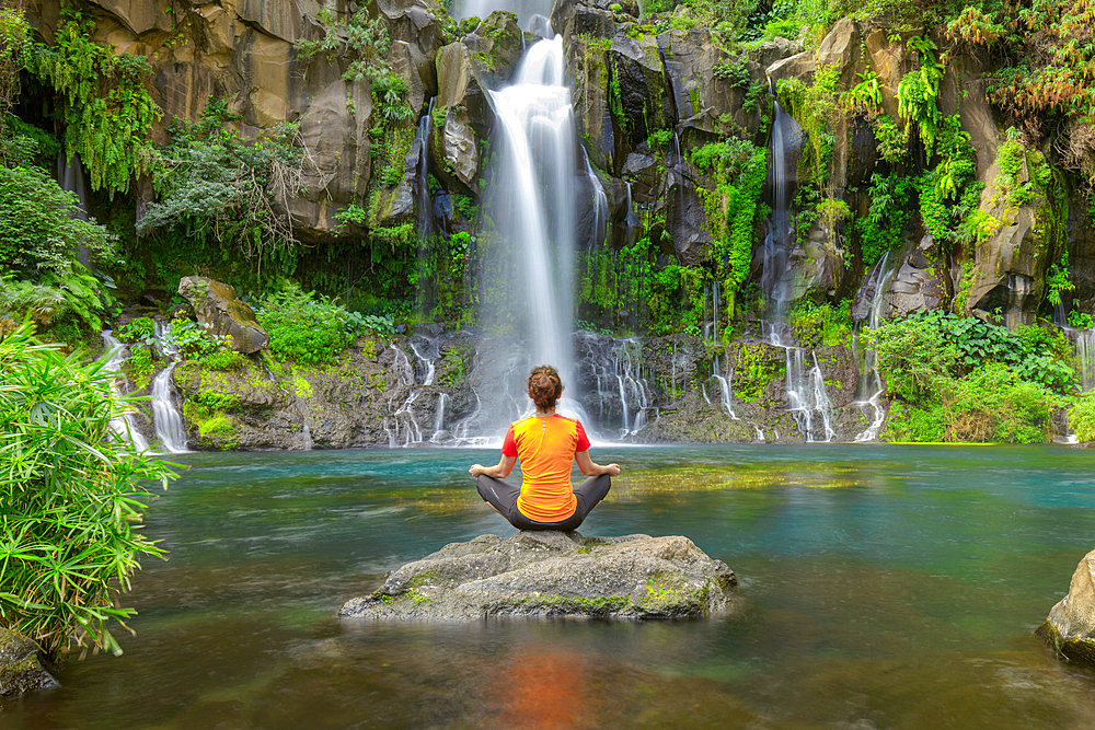 Woman at the edge of Bassin des Aigrettes, Saint Gilles, Reunion Island, France