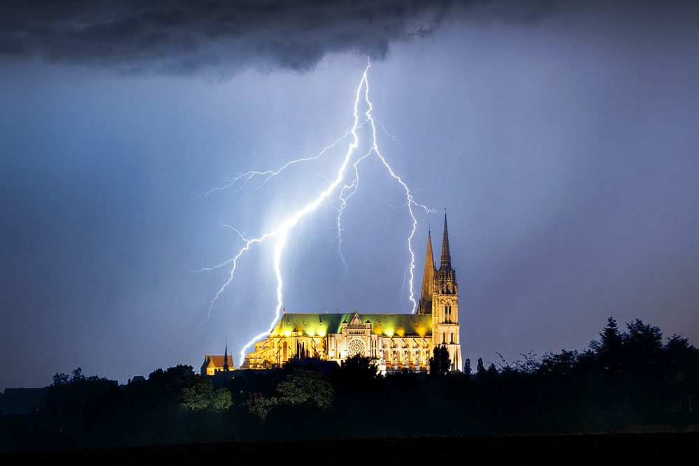 The cathedral and the storm. Thunderstorm over Voves seen from Chartres on the night of 2 to 3 September 2022, Eure-et-Loir, France