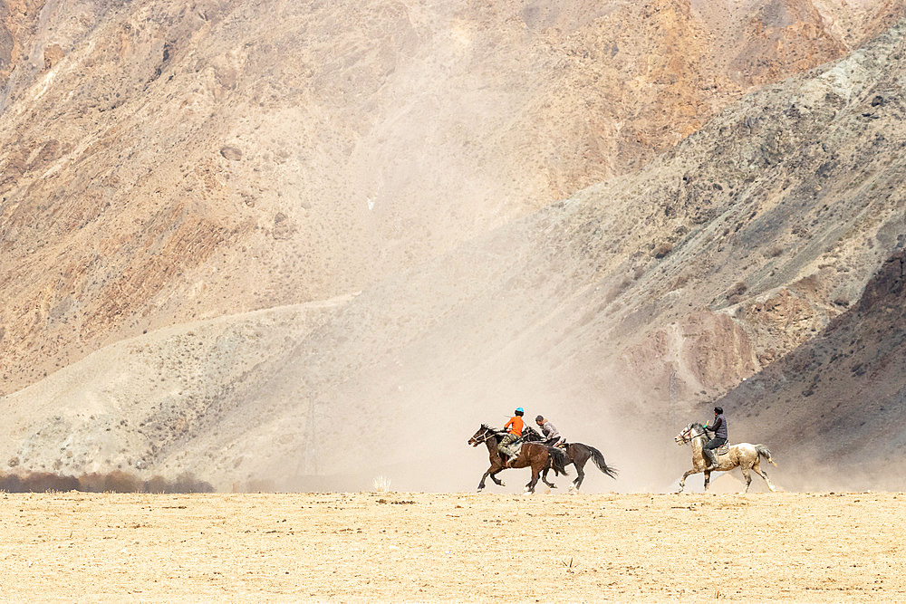 Riders at a game of Kok-boru (or Ulak-tartish or Buzkachi), Central Asian equestrian games at the Noorus festival, Kotchkor, Naryn Region, Kyrgyzstan