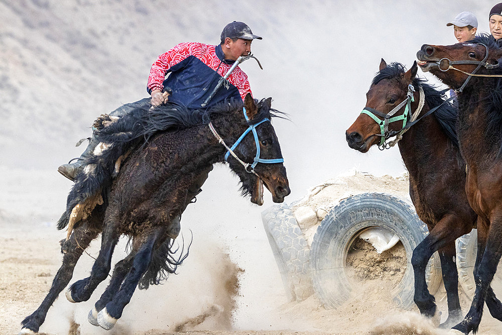 Riders at a game of Kok-boru (or Ulak-tartish or Buzkachi), Central Asian equestrian games at the Noorus festival, Kotchkor, Naryn Region, Kyrgyzstan